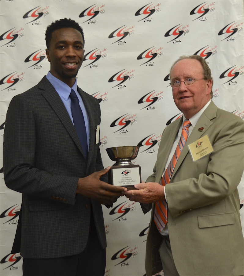 Donald Hicks Receiving Award for Boys Basketball Outstanding Athlete from Steve Johnson